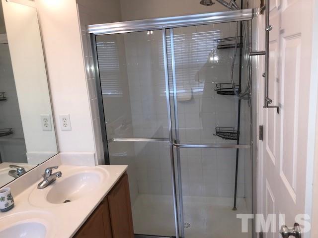 4905 Midstone Lane Raleigh, NC 27610 - Photo 11 of 22 a bathroom with a shower and a sink