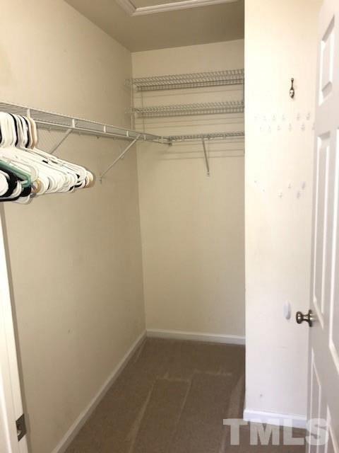 4905 Midstone Lane Raleigh, NC 27610 - Photo 12 of 22 a view of a room with rack on the wall