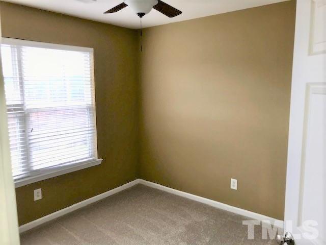 4905 Midstone Lane Raleigh, NC 27610 - Photo 13 of 22 a view of an empty room with a window