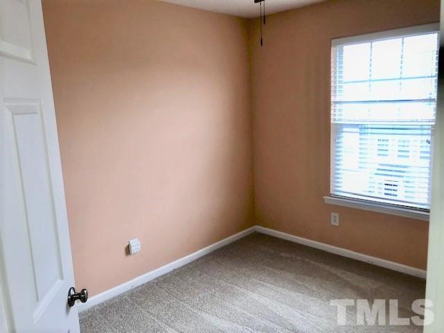 4905 Midstone Lane Raleigh, NC 27610 - Photo 14 of 22 an empty room with a window
