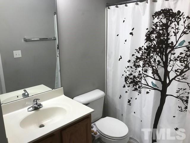 4905 Midstone Lane Raleigh, NC 27610 - Photo 15 of 22 a bathroom with a sink toilet and shower