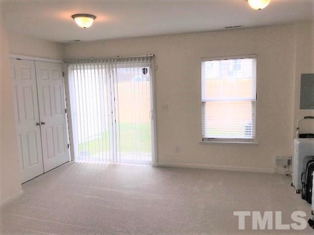 4905 Midstone Lane Raleigh, NC 27610 - Photo 17 of 22 a view of an empty room with a window