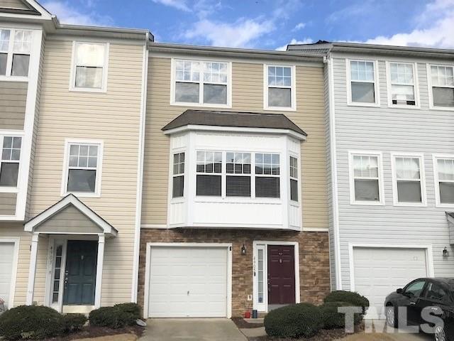 4905 Midstone Lane Raleigh, NC 27610 - Photo 20 of 22 a front view of a house with many windows