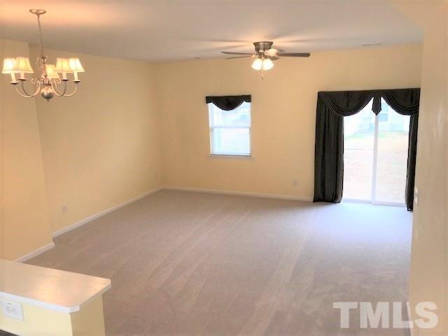 4905 Midstone Lane Raleigh, NC 27610 - Photo 6 of 22 en empty room with windows and fan