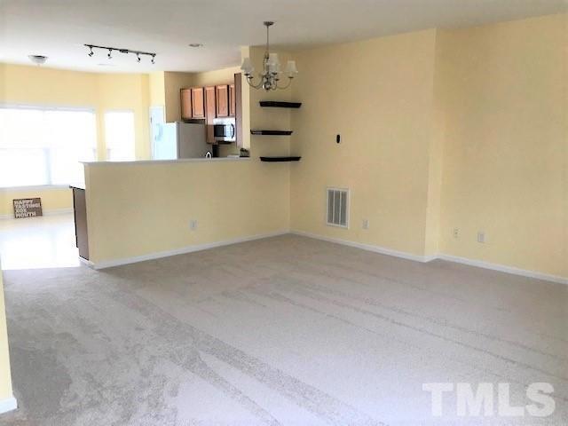 4905 Midstone Lane Raleigh, NC 27610 - Photo 7 of 22 a view of a kitchen with a sink