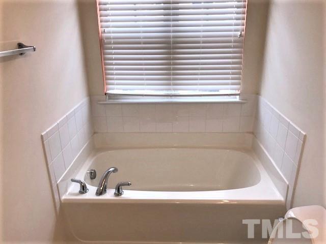 4905 Midstone Lane Raleigh, NC 27610 - Photo 10 of 22 a bathroom with a bathtub