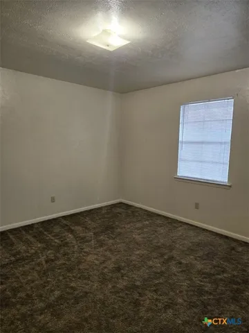 an empty room with a empty space and window