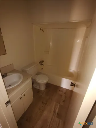 a bathroom with a sink and toilet
