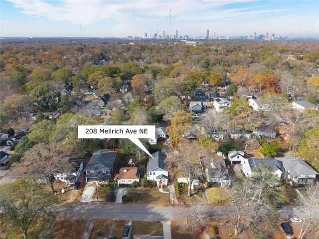 an aerial view of residential building with green space