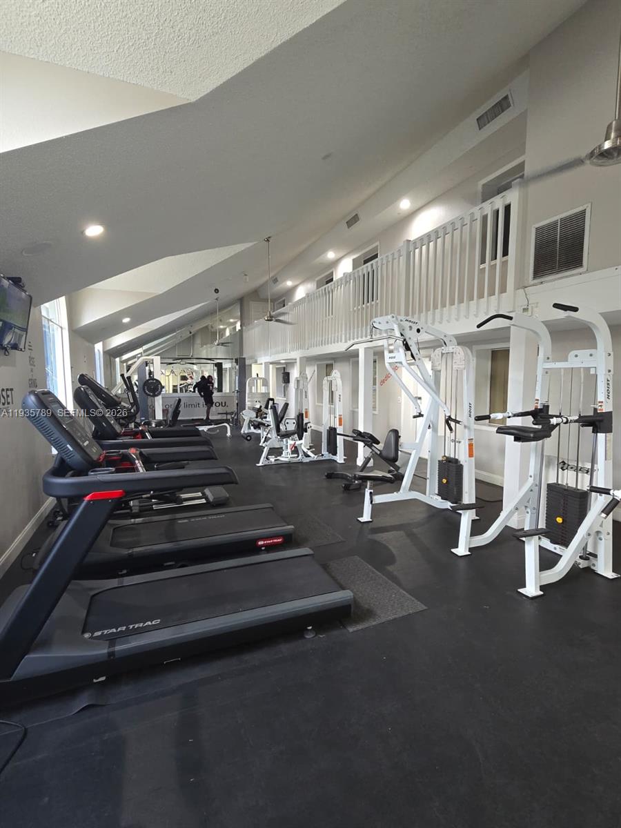 4518 Commander Drive, Unit 1928 Orlando, FL 32822 - Photo 2 of 16 a view of a room with gym equipment