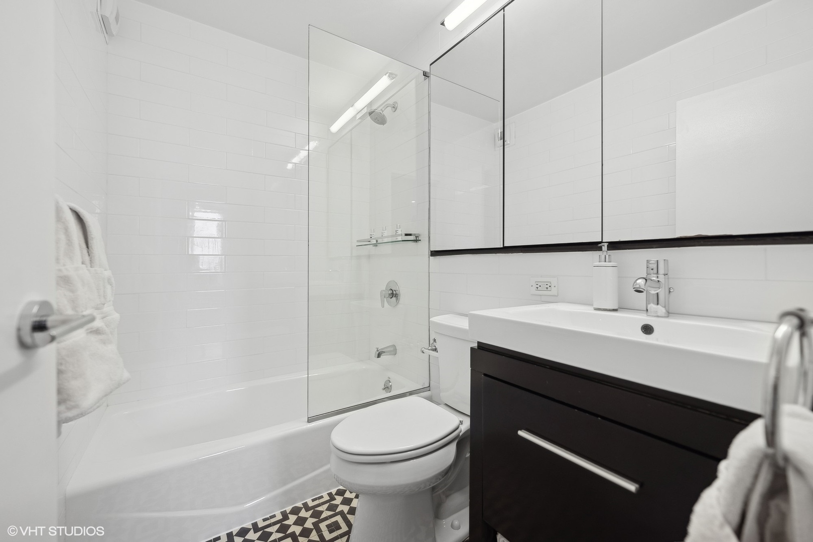 1310 North Ritchie Court, Unit 4C Chicago, IL 60610 - Photo 20 of 28 a bathroom with a sink a toilet and shower
