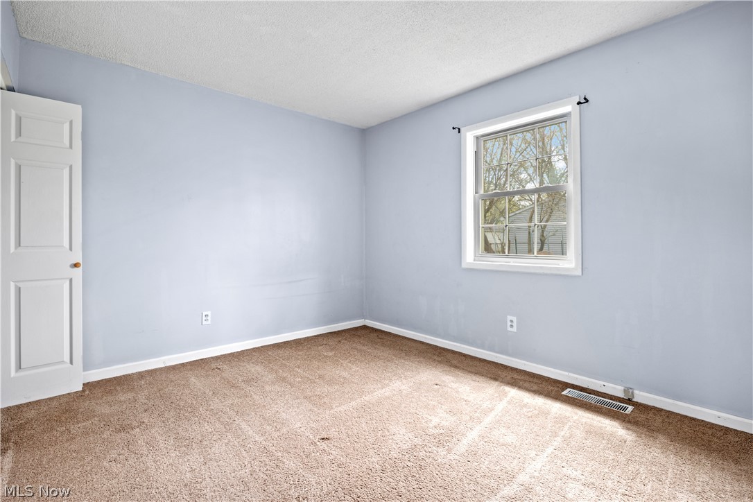 34067 Bainbridge Road North Ridgeville, OH 44039 - Photo 22 of 33 Unfurnished room with a textured ceiling and carpet
