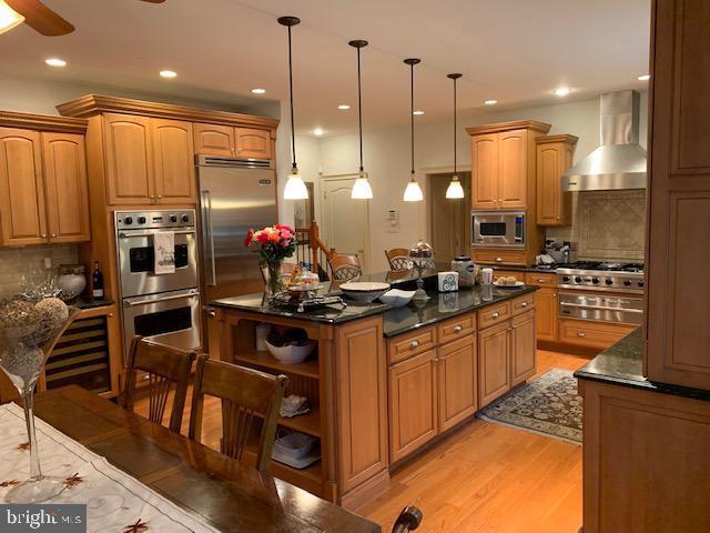 12 Pendleton Court Medford, NJ 08055 - Photo 22 of 24 a kitchen with stainless steel appliances granite countertop a stove a sink and a refrigerator
