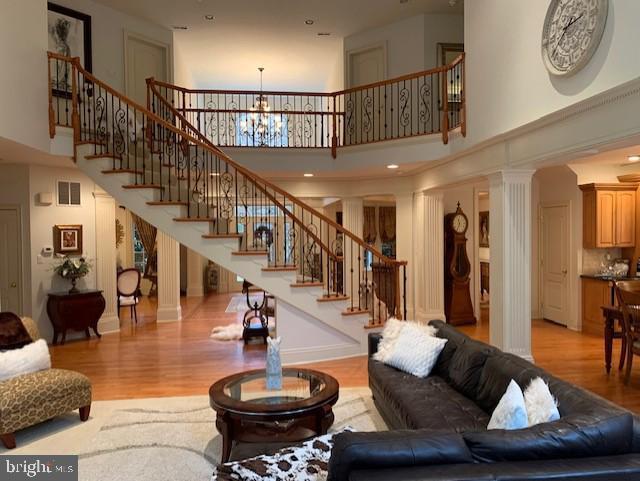 12 Pendleton Court Medford, NJ 08055 - Photo 5 of 24 a living room with furniture and a chandelier