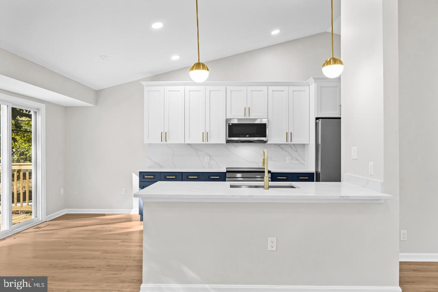 10290 South Grant Avenue Manassas, VA 20110 - Photo 12 of 41 a kitchen with stainless steel appliances granite countertop a sink a stove and a refrigerator