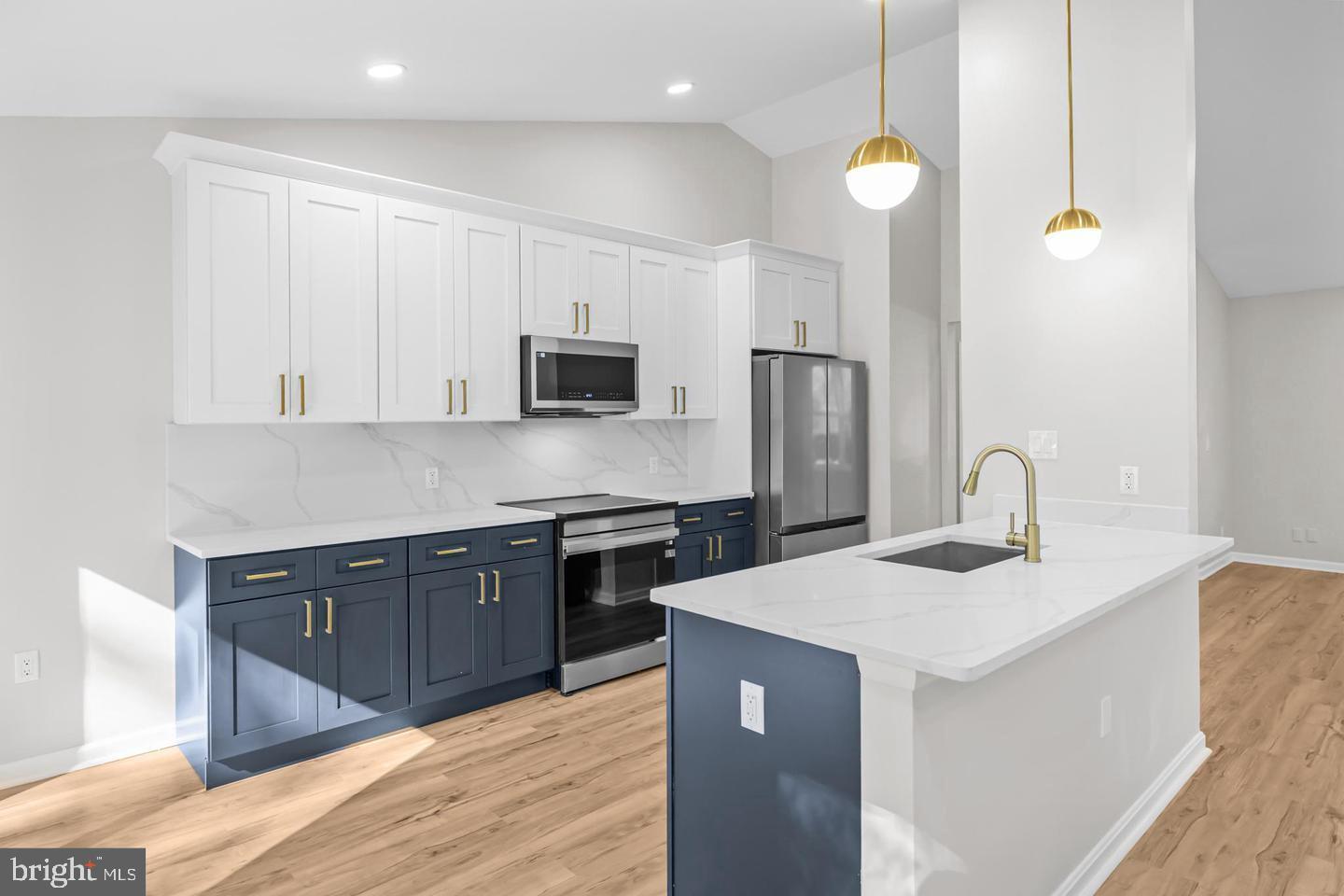 10290 South Grant Avenue Manassas, VA 20110 - Photo 13 of 41 a kitchen with stainless steel appliances granite countertop a sink a stove a refrigerator cabinets and living room view
