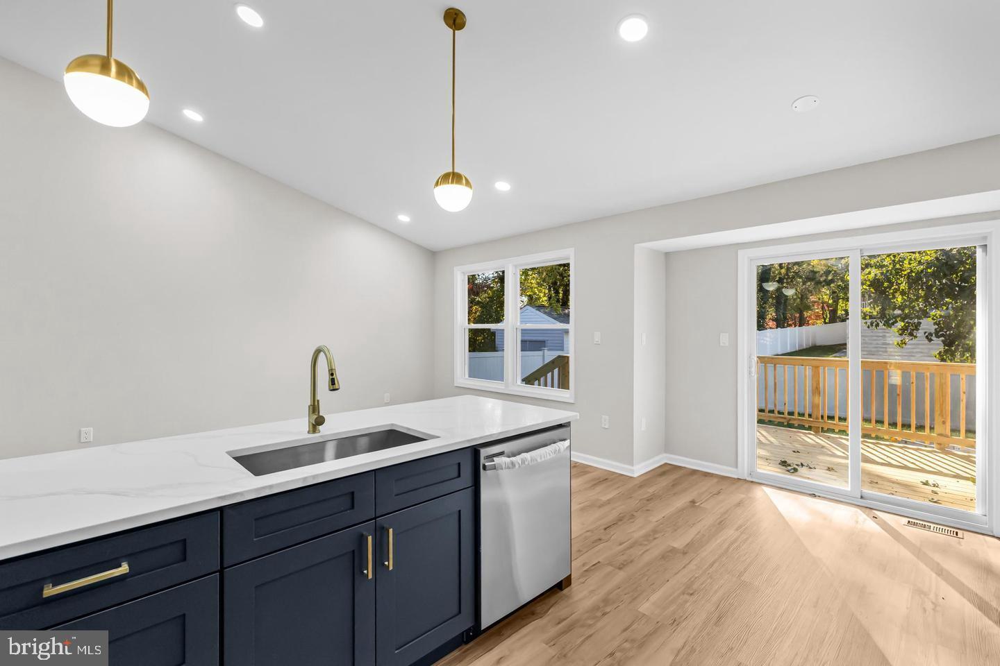 10290 South Grant Avenue Manassas, VA 20110 - Photo 17 of 41 a kitchen with a sink appliances and a large window