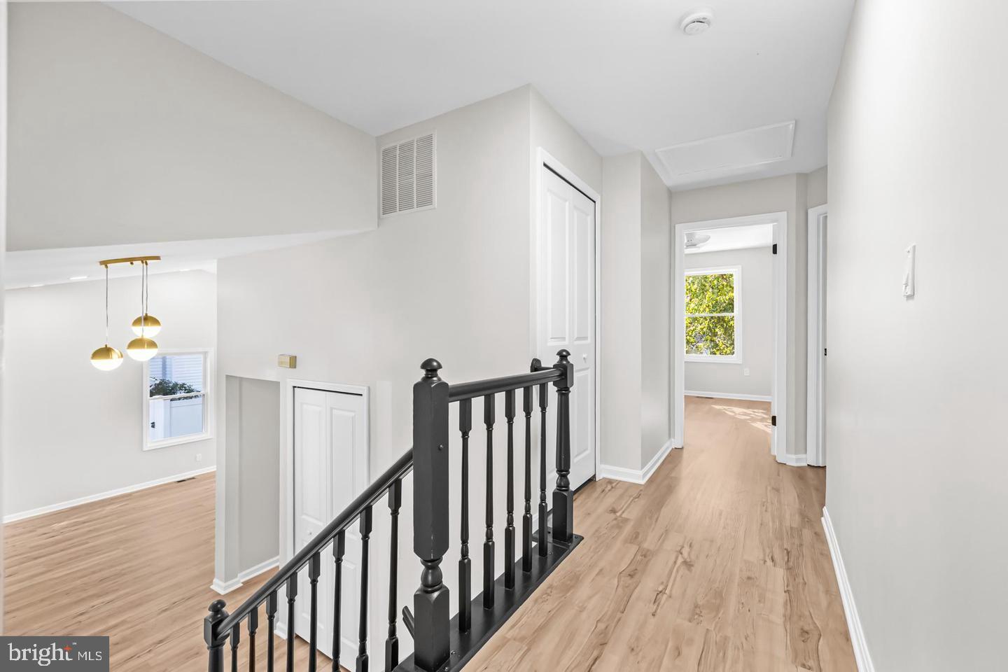 10290 South Grant Avenue Manassas, VA 20110 - Photo 19 of 41 a view of a hallway with wooden floor and stairs