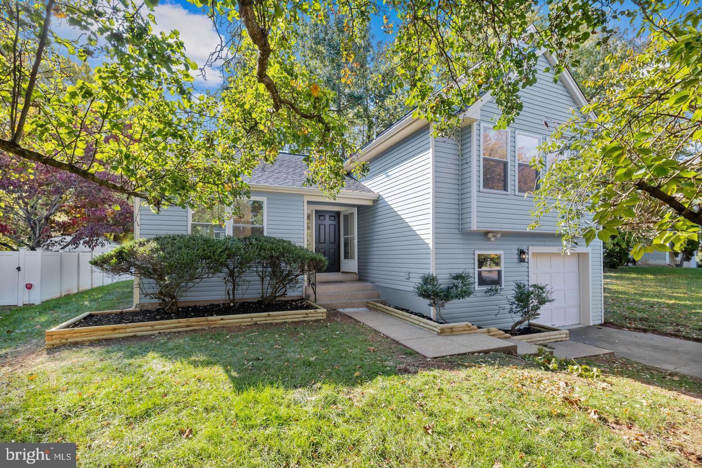 10290 South Grant Avenue Manassas, VA 20110 - Photo 2 of 41 a view of a house with backyard and sitting area