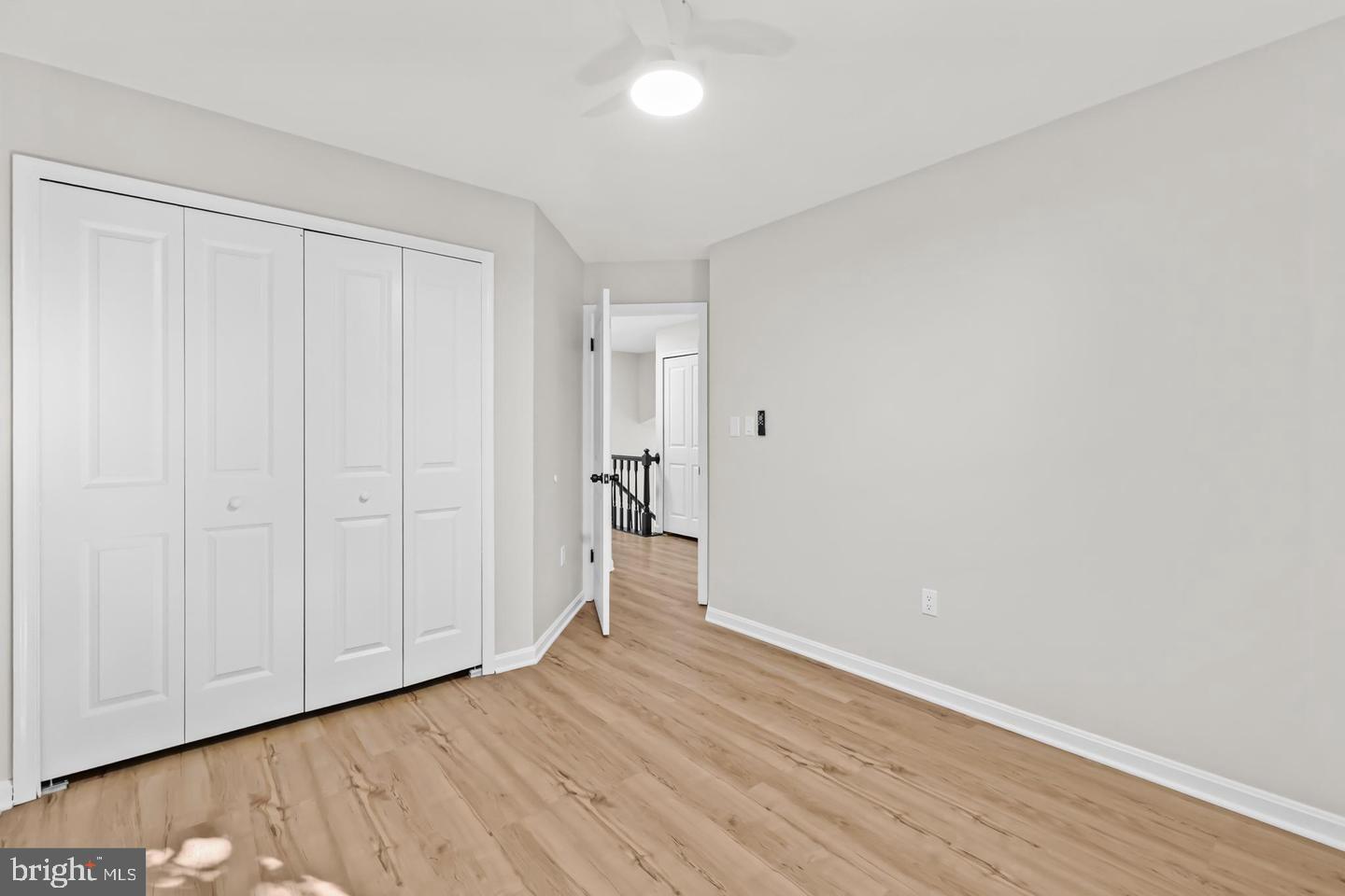 10290 South Grant Avenue Manassas, VA 20110 - Photo 27 of 41 a view of an empty room with wooden floor