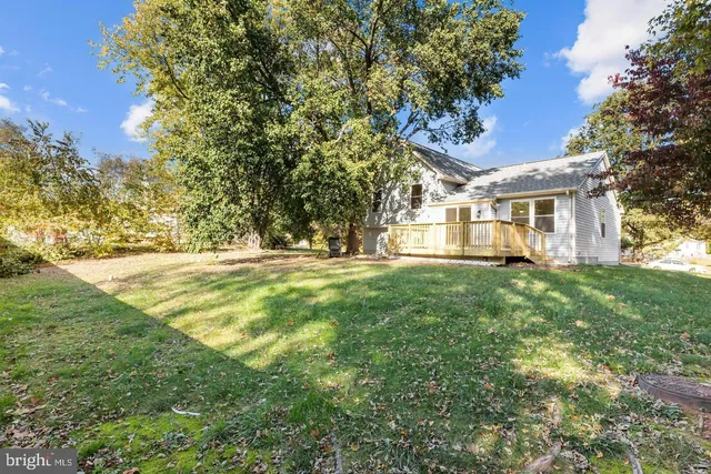 a view of house with yard