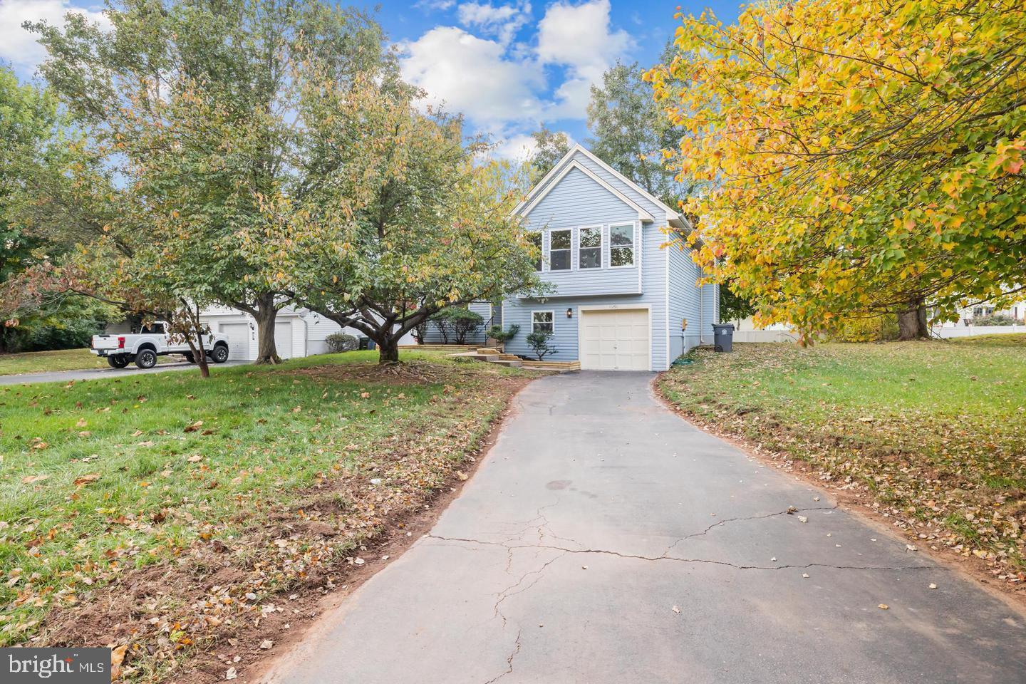 10290 South Grant Avenue Manassas, VA 20110 - Photo 5 of 41 a front view of a house with garden