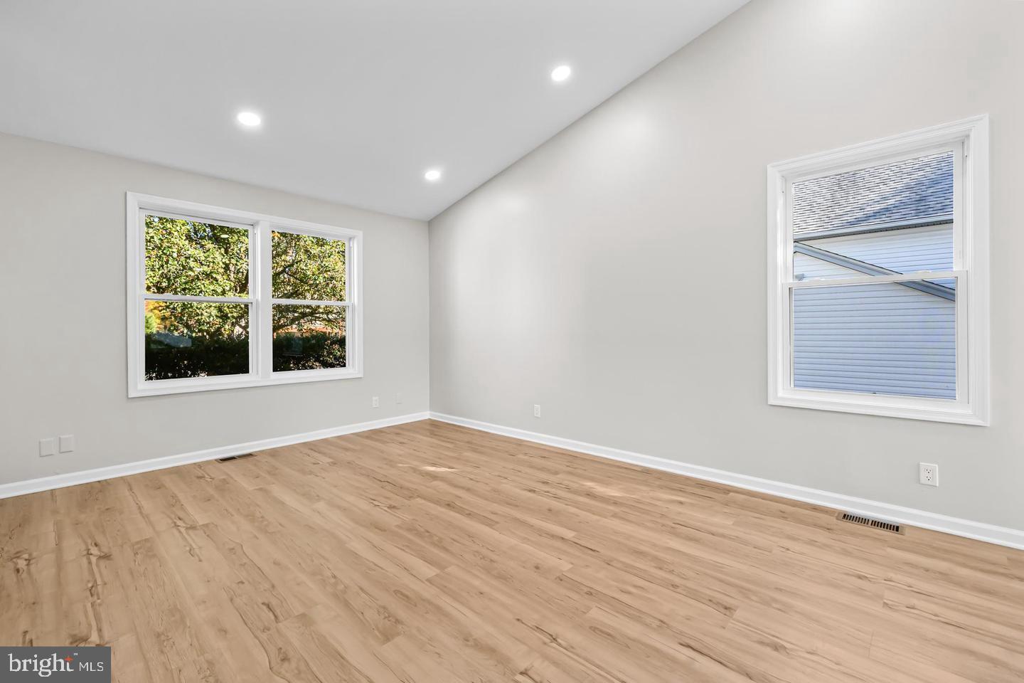 10290 South Grant Avenue Manassas, VA 20110 - Photo 9 of 41 a view of an empty room with wooden floor and a window