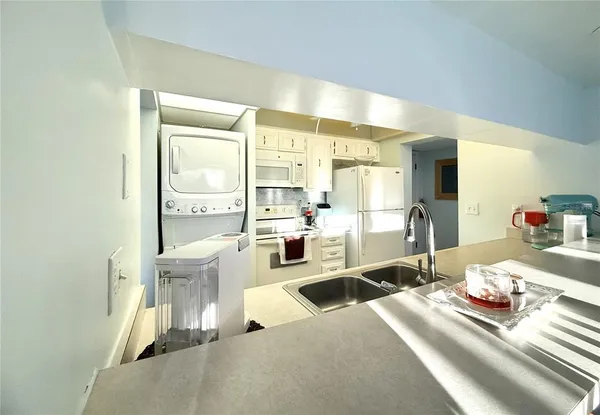 a living room with furniture a flat screen tv and a large window