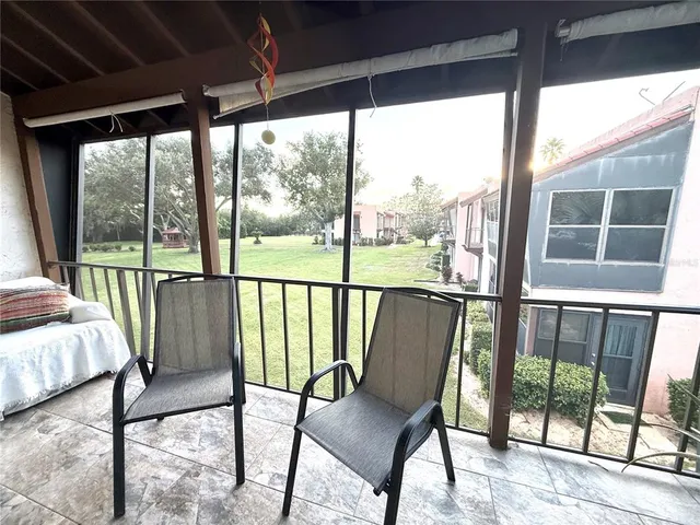 a view of balcony with wooden floor