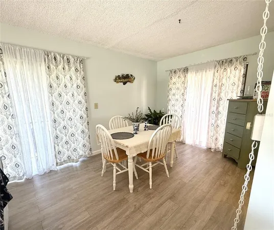a dining room with furniture window wooden floor