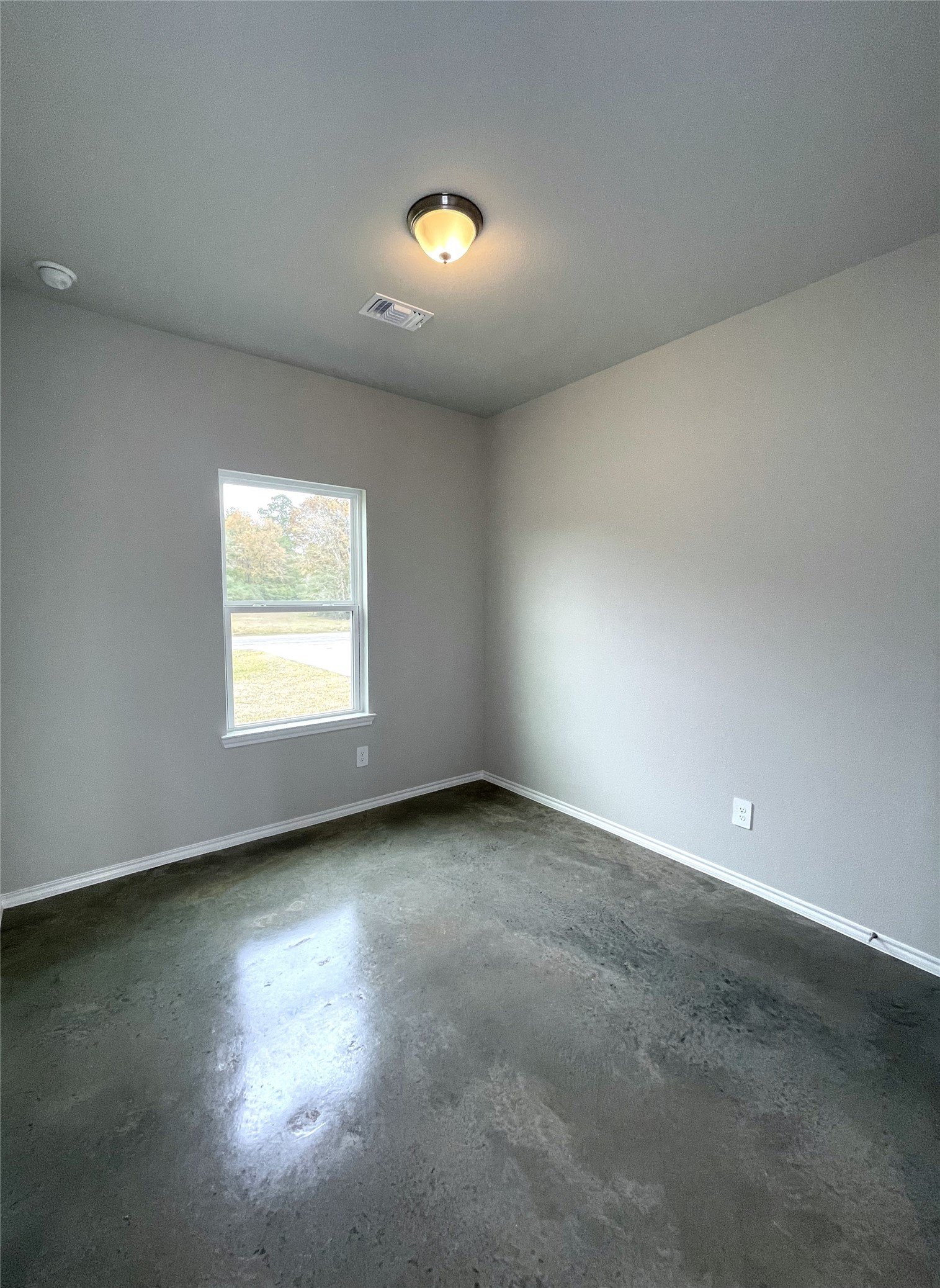 6 Greenway Drive Trinity, TX 75862 - Photo 23 of 28 an empty room with a window