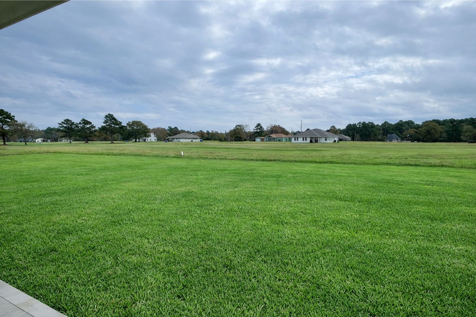 6 Greenway Drive Trinity, TX 75862 - Photo 27 of 28 a view of a green field with trees in the background