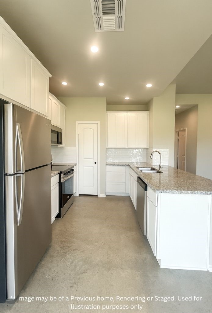 6 Greenway Drive Trinity, TX 75862 - Photo 9 of 28 a kitchen with granite countertop a refrigerator and a sink