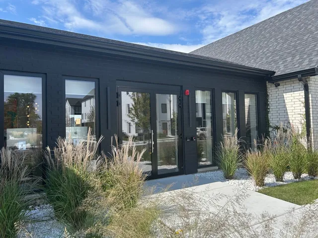 a swimming pool with outdoor seating and yard