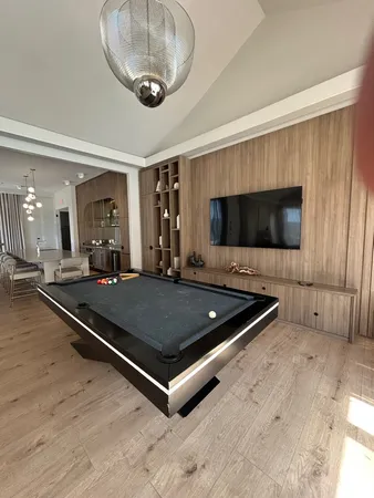 a large white building with a yard in front of it