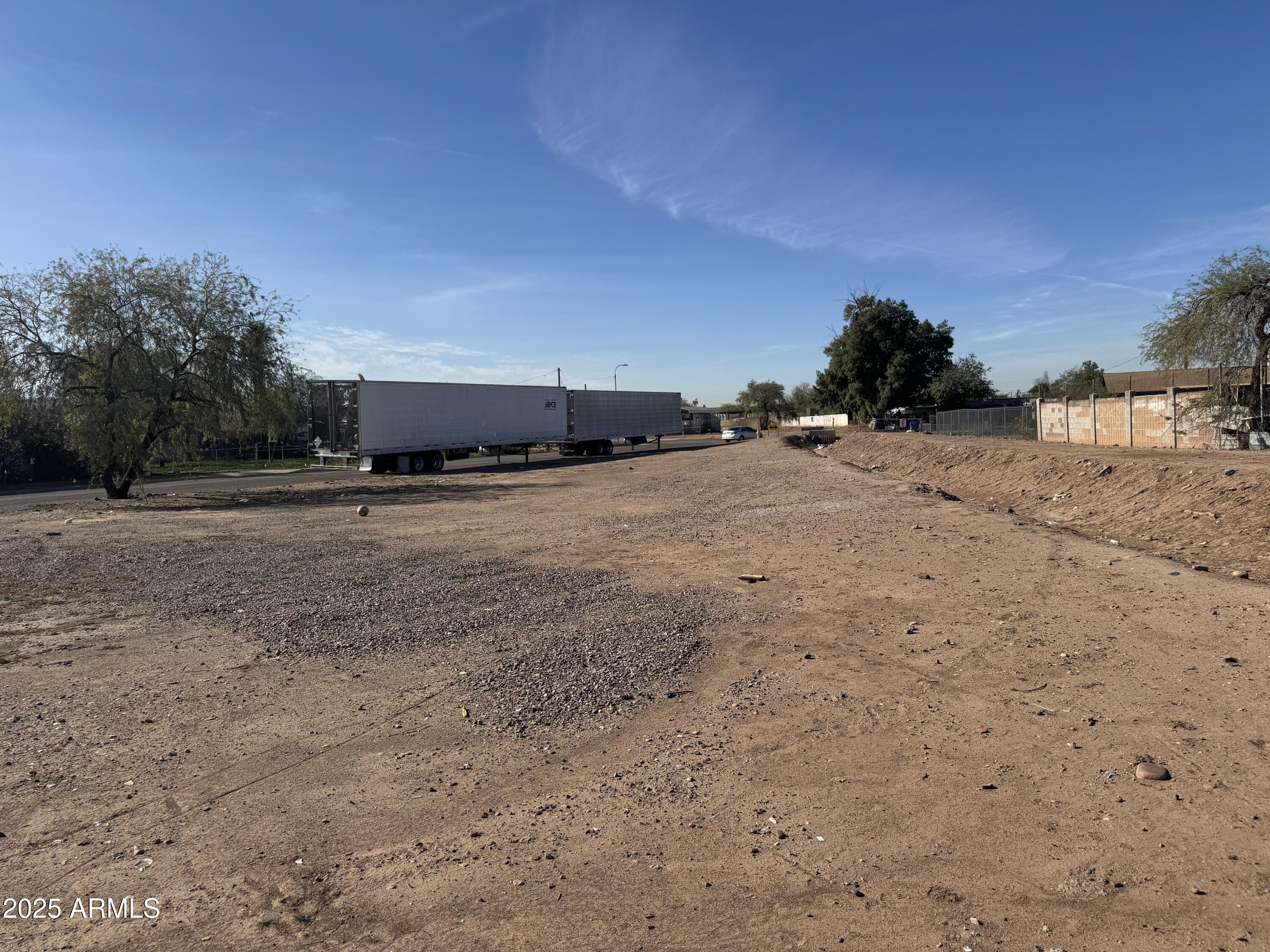820 East Chipman Road, Unit 1 Phoenix, AZ 85040 - Photo 7 of 7 a view of dirt road with a building in the background