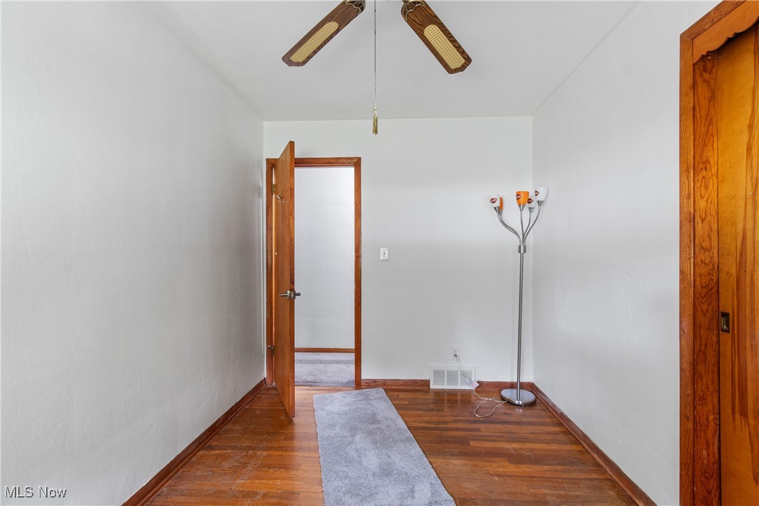 1067 Munroe Falls Kent Road Kent, OH 44240 - Photo 17 of 31 Unfurnished room with ceiling fan and hardwood / wood-style floors