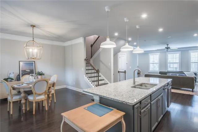 a kitchen with a dining table and chairs