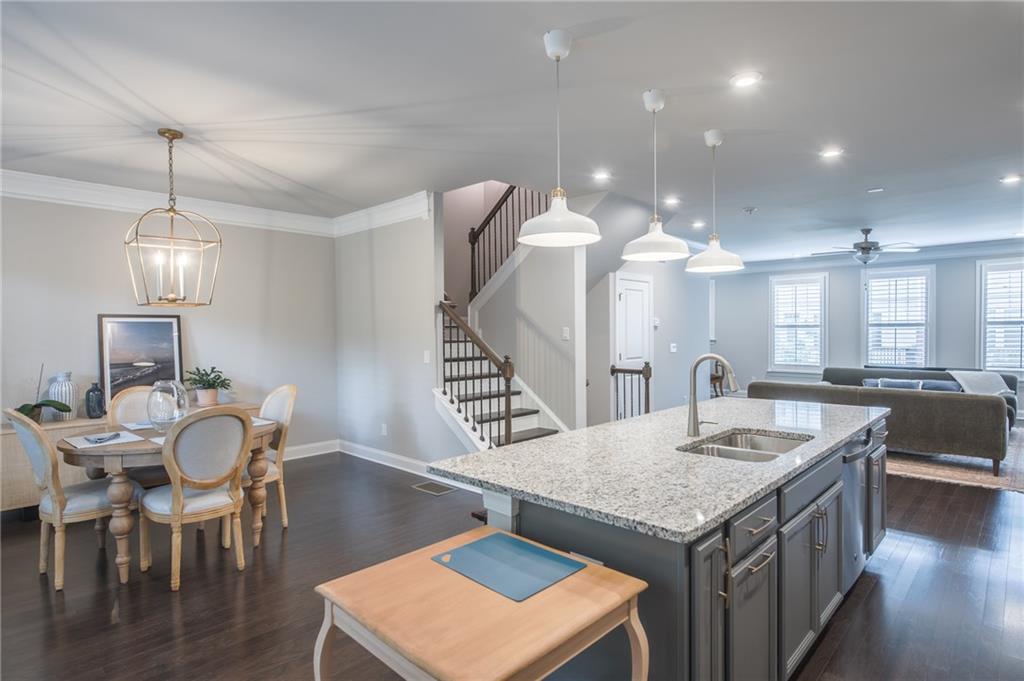 1367 Harris Way Street Brookhaven, GA 30319 - Photo 13 of 49 a kitchen with a dining table and chairs
