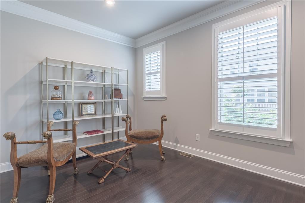 1367 Harris Way Street Brookhaven, GA 30319 - Photo 19 of 49 a view of a workspace with furniture and a window