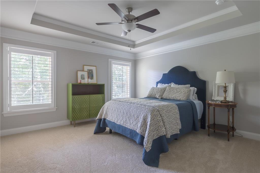 1367 Harris Way Street Brookhaven, GA 30319 - Photo 20 of 49 a bed sitting in a bedroom next to a window