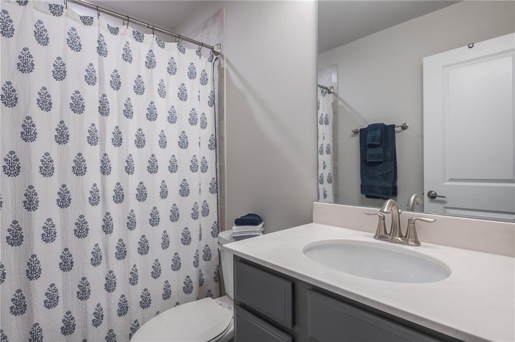 1367 Harris Way Street Brookhaven, GA 30319 - Photo 25 of 49 a bathroom with a sink and a mirror