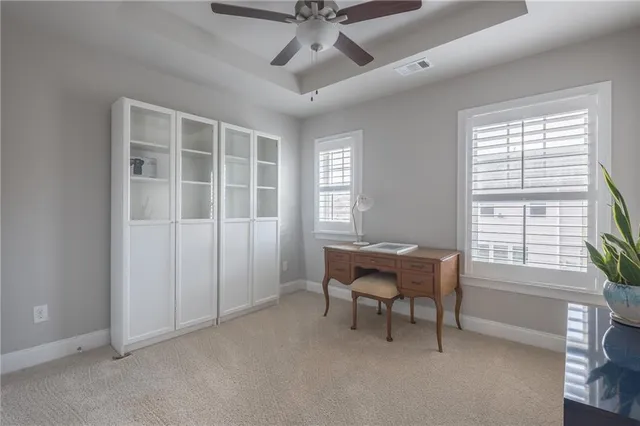 a dining room with a window and furniture