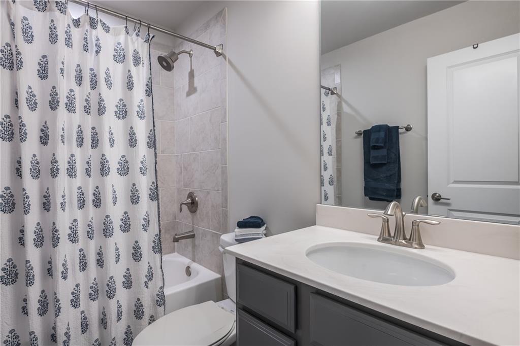 1367 Harris Way Street Brookhaven, GA 30319 - Photo 29 of 49 a bathroom with a sink toilet and shower