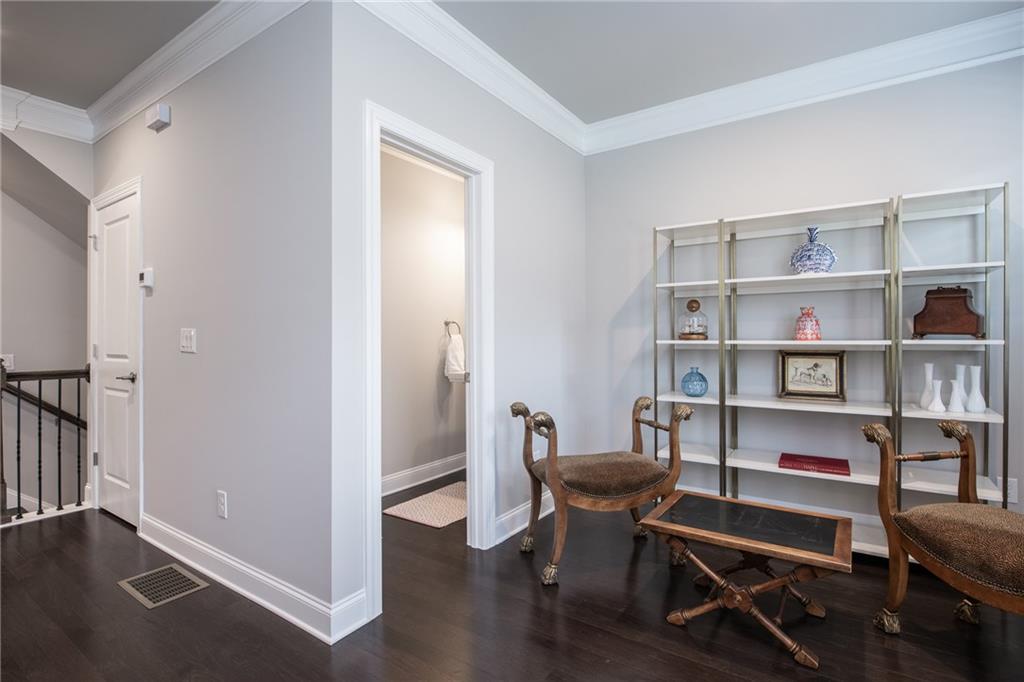 1367 Harris Way Street Brookhaven, GA 30319 - Photo 32 of 49 a view of a workspace with furniture and wooden floor