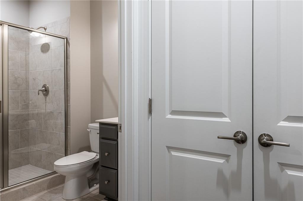 1367 Harris Way Street Brookhaven, GA 30319 - Photo 34 of 49 a bathroom with a toilet and a shower
