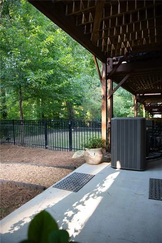 a backyard of a house with a table and chairs