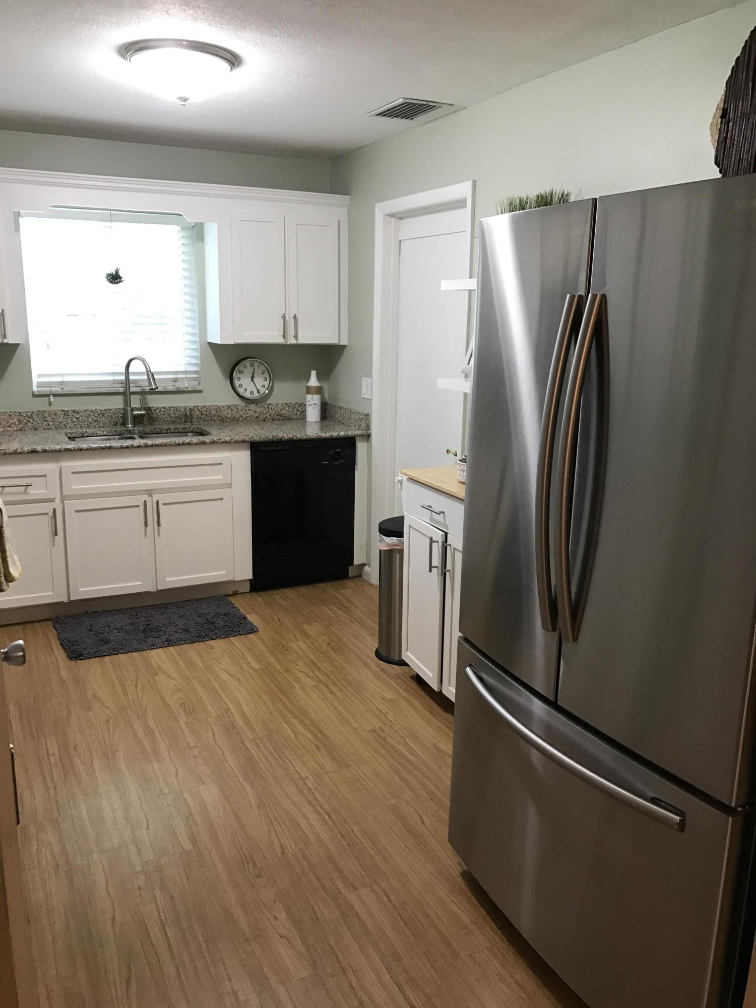 315 Pineview Road Jupiter, FL 33469 - Photo 23 of 42 Door to The Garage