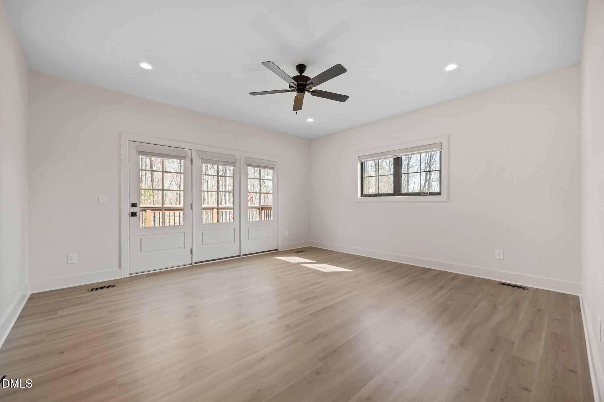 6450 Moores Mill Road Rougemont, NC 27572 - Photo 23 of 66 a view of an empty room with a window and wooden floor