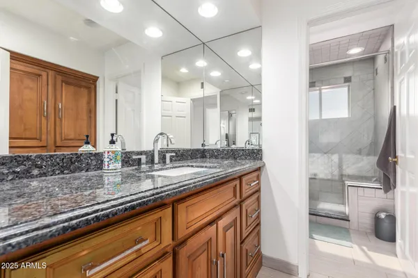 a bathroom with a sink and a mirror